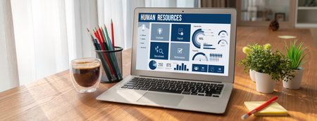 Human resources management software on computer screen helping human resources employee to manage recruitment, payroll, staff searching and KPI evaluation snuglyの写真素材