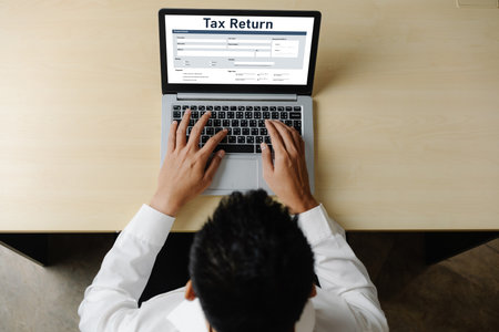 Online tax return form for submitting individual income tax return form snugly on the internet website. Government web for tax payment and return. Taxation technology concept.の写真素材