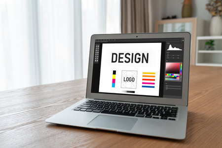 Graphic designer software for modern design of web page and commercial ads showing on the computer screenの写真素材