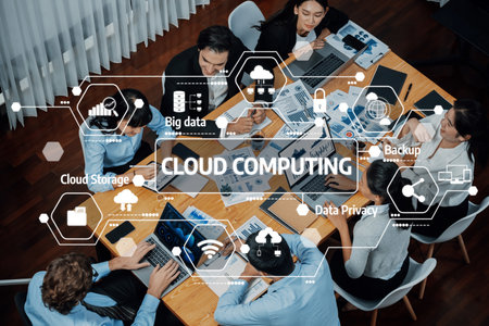Diverse team members actively collaborating on cloud computing strategies with digital tools and visual aids in a contemporary office setting. Amityの写真素材