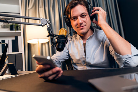 Host channel in smart broadcaster promote fanclub page on social media with share, post, like and comment on streaming record to follow live time up to date at modern studio in warm light.の写真素材