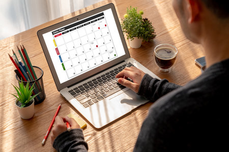 Calendar on computer software application for modish schedule planning for personal organizer and online businessの写真素材