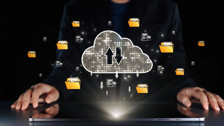 A visually striking representation of cloud computing technology, showcasing data transfer with folders and arrows above a sleek laptop, symbolizing modern digital solutions. Qubitの写真素材