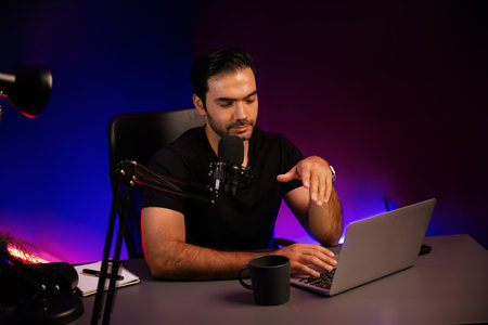 Broadcaster talking to fanclub listener using mic, discussing financial issue any problem in live streaming on with by creative positive thinking concept at purple neon light modern studio. Surmise.の写真素材