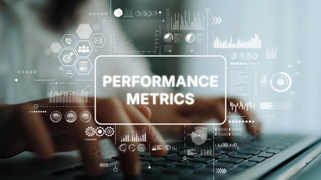Hands Typing on Laptop Amidst Performance Metrics and Data Visualization Graphics in Modern Workspace Environment. Asymptotic smart data analytic.の写真素材