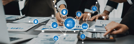 A dynamic business meeting showcasing collaboration as team members engage with digital tools and...