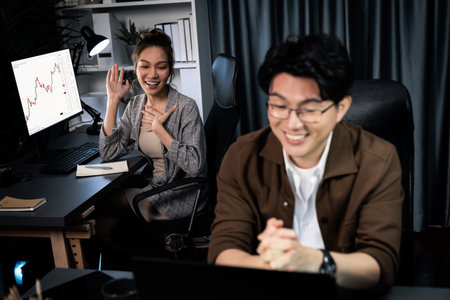 Smiling businesswoman trader with partner discussing on stock market trading exchange in casual...
