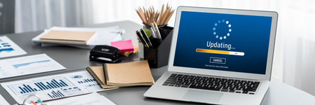 Data analysis dashboard display on laptop screen on office table with financial papers by Fintech BI technology for business marketing and strategy in corporate meeting room. Insightの写真素材