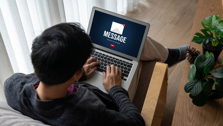 Email notification message showing on computer screen snugly. Digital marketing message information text from business to customer clientの写真素材