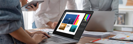 Graphic designer software for modern design of web page and commercial brisk ads showing on the...