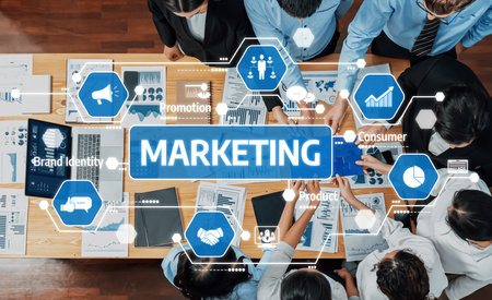 A group of professionals engages in a marketing strategy session, analyzing data and charts to enhance business promotion and improve consumer connections through collaboration. Amityの写真素材