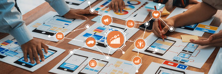 A dynamic setting showcasing teamwork and analysis with hands collaborating over charts, graphs, and...