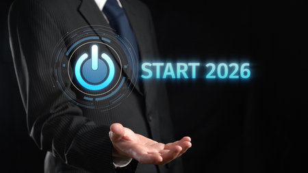 A professional man presenting the Start 2026 concept with a power button symbol in a dark...