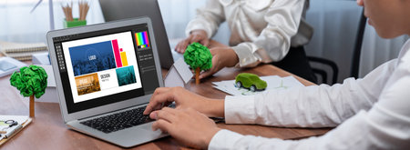 Graphic designer software for modern design of web page and commercial brisk ads showing on the computer screenの写真素材