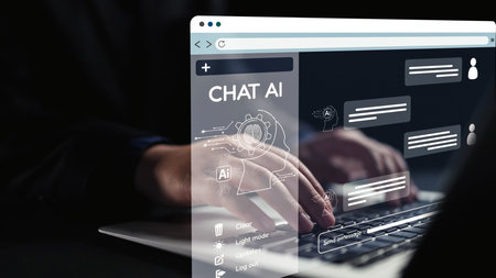 A modern scene showcasing hands typing on a laptop where a futuristic chat AI interface displays conversation bubbles, emphasizing technology and communication.の写真素材