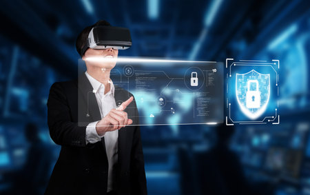 A businessman engages with virtual reality technology to enhance cybersecurity and data privacy in an advanced online environment, ensuring information safety. XDMCPの写真素材