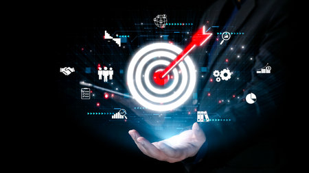 A businessman confidently presents a holographic target with an arrow, symbolizing growth and success in digital marketing, showcasing innovation through analytics and technology.の写真素材