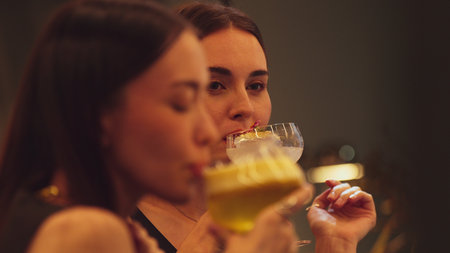 Enjoy drinking mixed vodka cocktails at luxurious counter bar toasting with friends scene capture essence nightlife luxury with special highlighting refreshment friendship.の写真素材