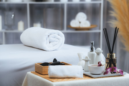 Exquisite display of beauty treatment and spa salon accessories arranged on spa table in luxury spa...