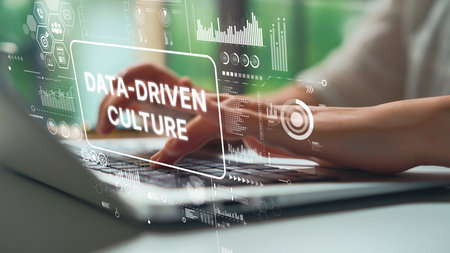 Hands Typing on Laptop with Data-Driven Culture Concept Featuring Graphs and Digital Graphics. Asymptotic smart data analytic.の写真素材