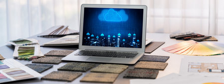 Interior designer workspace table and architecture software on laptop screen with mood board materials and colorful swatch color for color selection. Modern interior design office. Insightの写真素材