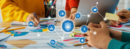 Modern workspace featuring hands-on collaboration focused on security concepts, with technology...