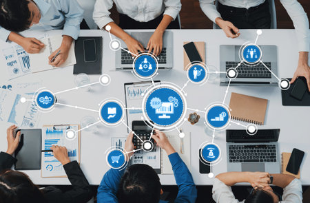 Engaging business meeting in a modern office featuring teamwork, laptops, digital tools, and data presentations, highlighting collaboration and productivity strategies. Amityの写真素材
