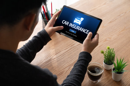 car insurance online website on computer screen for insure your car damage snuglyの写真素材