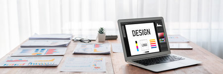 Graphic designer software for modern design of web page and commercial brisk ads showing on the computer screenの写真素材