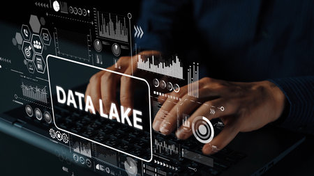 Hands Typing on Laptop with Data Lake Graphics and Digital Analytics Visuals Representing Big Data Management. Asymptotic smart data analytic.の写真素材