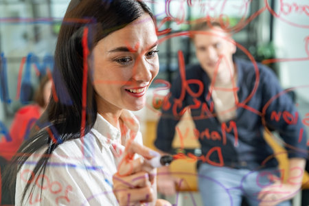 Professional business team brainstorming and working together about marketing project. Female...