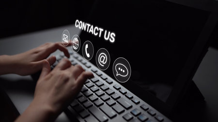 UI concept for contact us section showing icons for email, web, phone, and message. Contact and support icons help streamline business communication and improve customer contact experience. Muxerの写真素材