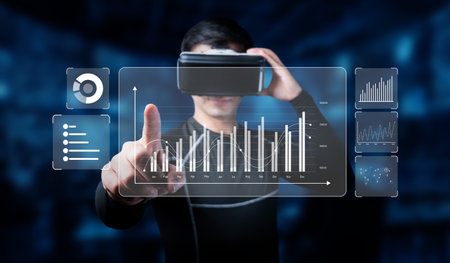A man uses virtual reality technology to engage with interactive data analytics, showcasing...
