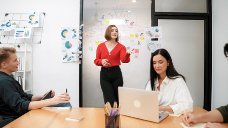 Young beautiful leader presents marketing strategy while expert investor and project manager...