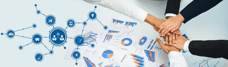 Analyst team putting hand together after successful plan of business strategy and marketing....