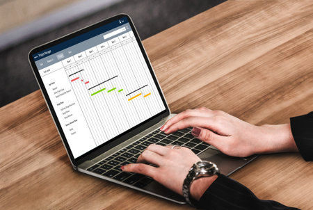 Project planning software for modish business project management on the computer screen showing...