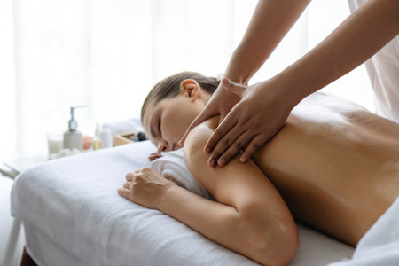 Caucasian woman customer enjoying relaxing anti-stress spa massage and pampering with beauty skin...