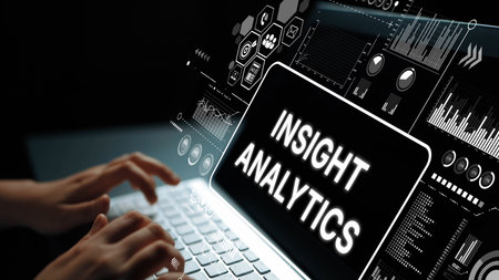 Hands Typing on Laptop Displaying Insight Analytics with Data Charts and Graphs Representing...
