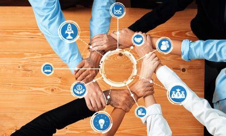 A captivating image showcasing diverse hands joining in unity over a table, symbolizing...