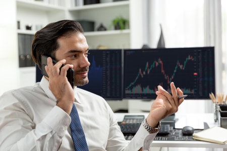 Trader businessman calling to consultant or partner with two stock exchange investment, compare data analysis to invest high profit value dynamic financial technology stock market at office. Surmise.の写真素材