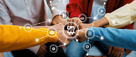 A diverse group of individuals demonstrates teamwork and collaboration in a management setting, with...