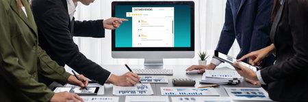 Panorama shot analyst team utilizing BI Fintech to analyze financial report with laptop. Businesspeople analyzing BI data dashboard displayed on laptop screen for business insight. Prodigyの写真素材