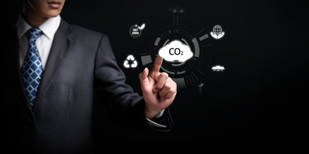 Business person implements initiatives to reduce CO2 emissions, aiming for net zero. Showcases commitment to sustainability by reducing CO2 for a greener planet. FaaSの写真素材