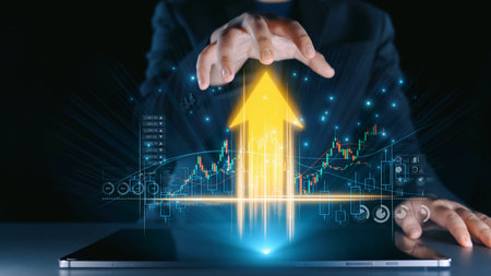 A professional hand reaching towards a digital chart on a laptop screen, illustrating financial...