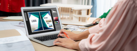 Graphic designer software for modern design of web page and commercial brisk ads showing on the...