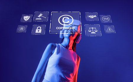A woman wearing a virtual reality headset interacts with copyright and law symbols, highlighting the importance of regulation in the online and digital environment.の写真素材