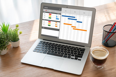 Project planning software for modish business project management on the computer screen showing...
