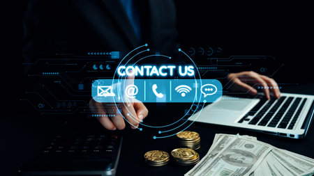A professional workspace scene depicting hands on a laptop with coins and cash nearby, highlighting...
