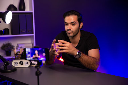 Broadcaster talking to listener on live streaming online, recording by smartphone setting on social...