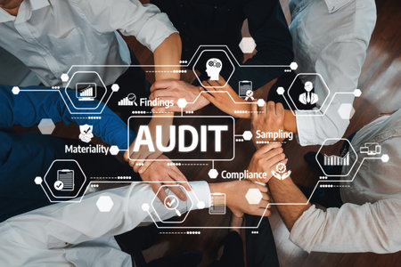 A top-down view of hands joined in collaboration for a financial audit process, emphasizing teamwork, compliance, and key audit components like sampling and materiality.の写真素材